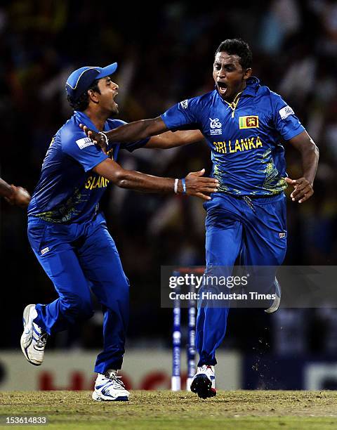 Sri Lankan player Ajantha Mendis celebrates the dismissal of West Indies player Chris Gayle during the ICC World T20 Final between Sri Lanka and West...