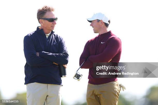 Rory McIlroy of Northern Ireland talks with putting coach, Brad Faxon during the Pro-Am prior to the Genesis Scottish Open at The Renaissance Club on...