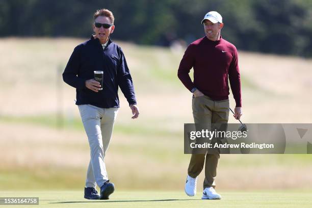 Rory McIlroy of Northern Ireland talks with putting coach, Brad Faxon during the Pro-Am prior to the Genesis Scottish Open at The Renaissance Club on...