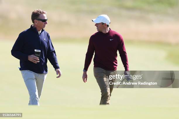 Rory McIlroy of Northern Ireland talks with putting coach, Brad Faxon during the Pro-Am prior to the Genesis Scottish Open at The Renaissance Club on...