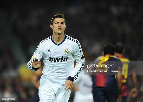 Cristiano Ronaldo of Real Madrid celebrates scoring his sides opening goal during the la Liga match between FC Barcelona and Real Madrid at the Camp...