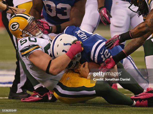 Hawk of the Green Bay Packers grabs Andrew Luck of the Indianapolis Colts on a 4th down play at Lucas Oil Stadium on October 7, 2012 in Indianapolis,...