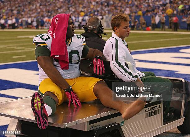 Raji of the Green Bay Packers is carted off of the field after an injury against the Indianapolis Colts at Lucas Oil Stadium on October 7, 2012 in...