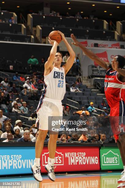 Byron Mullens of the Charlotte Bobcats shoots against the Washington Wizards at the Time Warner Cable Arena on October 7, 2012 in Charlotte, North...
