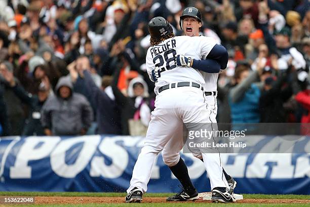 Don Kelly and Prince Fielder of the Detroit Tigers celebrate after Kelly drive in the game-winning run on a sacrifice flyin the bottom of the ninth...
