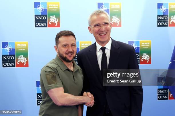 Ukrainian President Volodomyr Zelensky and NATO Secretary General Jens Stoltenberg arrive to speak to the media on the second day of the 2023 NATO...