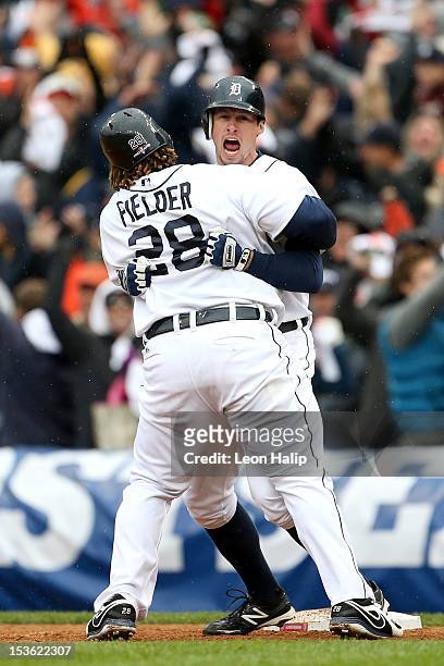 Don Kelly and Prince Fielder of the Detroit Tigers celebrate after Kelly drive in the game-winning run on a sacrifice flyin the bottom of the ninth...