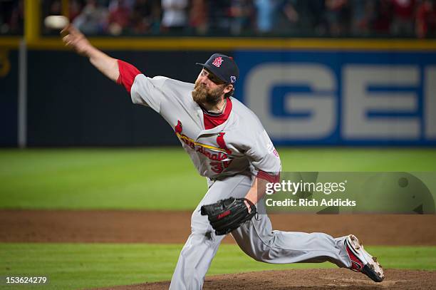 Jason Motte of the St. Louis Cardinals pitches against the Atlanta Braves during the National League Wild Card Game at Turner Field on Friday,...