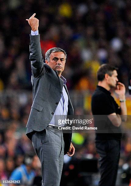 Head coach Jose Mourinho of Real Madrid CF reacts during the La Liga match between FC Barcelona and Real Mdrid CF at Camp Nou on October 7, 2012 in...