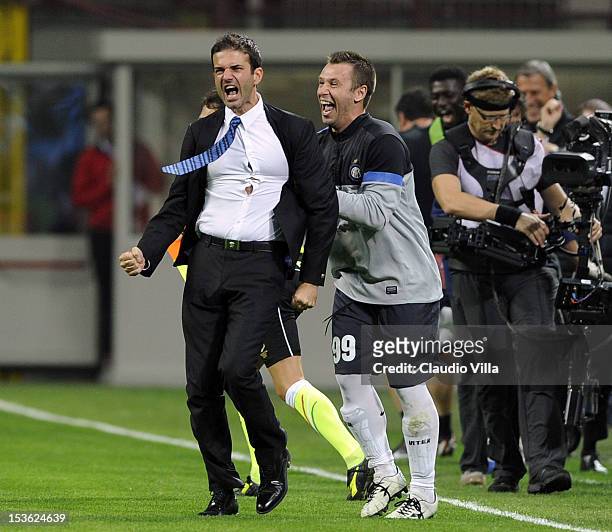 Head coach Andrea Stramaccioni of FC Inter Milan and Antonio Cassano celebrate victory at the end of the Serie A match between AC Milan and FC...