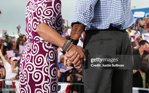 Republican presidential candidate, former Massachusetts Gov. Mitt Romney and his wife Ann Romney hold hands during a victory rally at Tradition Town...