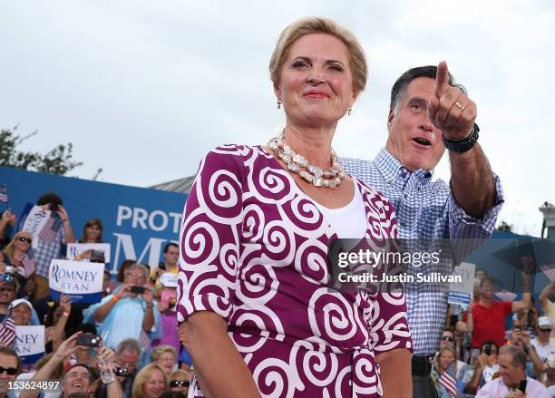 Republican presidential candidate, former Massachusetts Gov. Mitt Romney and his wife Ann Romney look on during a victory rally at Tradition Town...
