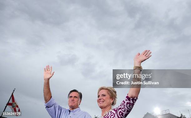 Republican presidential candidate, former Massachusetts Gov. Mitt Romney and his wife Ann Romney wave to supporters during a victory rally at...