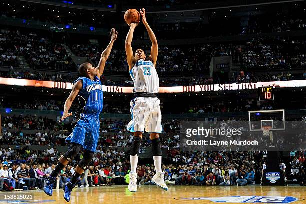 Anthony Davis of the New Orleans Hornets shoots against Armon Johnson of the Orlando Magic during the pre-season NBA Mexico Game 2012 presented by...