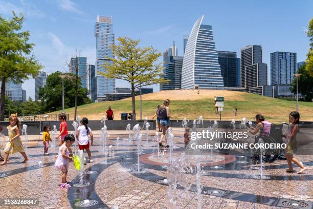 Residents cool off in the Liz Carpenter Splash Pad at Butler Park on July 16, 2023 in Austin, Texas, during a heat wave. Tens of millions of...