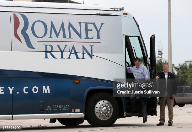 Republican presidential candidate, former Massachusetts Gov. Mitt Romney steps off of his bus before boarding his campaign plane on October 7, 2012...