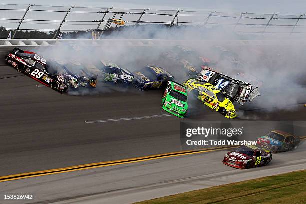 Tony Stewart, driver of the Mobil 1/Office Depot Chevrolet, flips in the air after and incident with the field in the final lap of the NASCAR Sprint...