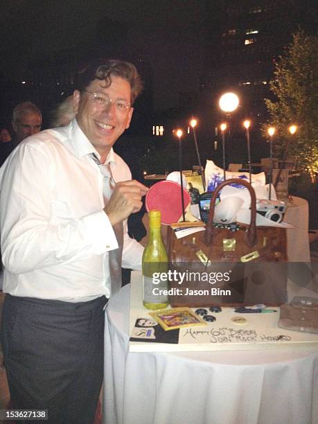 John Howard poses with Cake by Silvia Weinstock circa August 2012 in New York City.