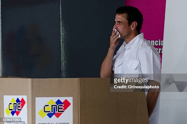 Presidential Candidate Henrique Capriles kisses his vote on October 07, 2012 in Caracas, Venezuela.