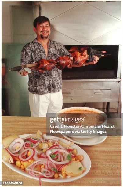 Super Rico, Peruvian Restaurant HOUCHRON CAPTION : Tito Ariansen tends the rotisserie at Super Rico, where pollo a la brasa, a chicken specialty, is...