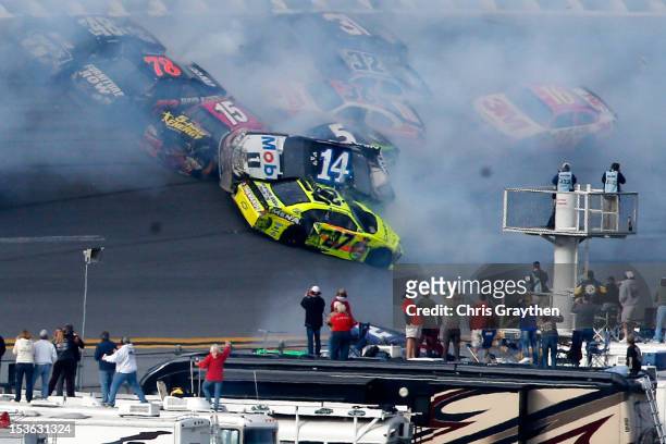 Tony Stewart, driver of the Mobil 1/Office Depot Chevrolet, flips in the air after an incident with the field in the final lap of the NASCAR Sprint...