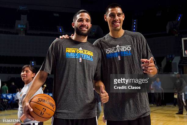 Players Greivis Vasquez and Gustavo Ayon pose for a picture during a training session of New Orleans Hornets and Orlando Magic with disabled people...