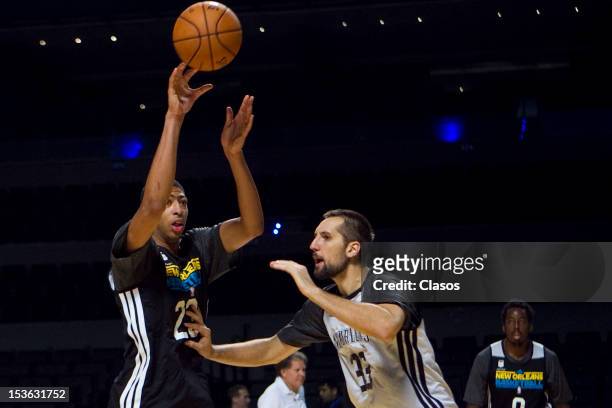 Players Anthony Davis and Ryan Anderson in action during a training session of New Orleans Hornets and Orlando Magic with disabled people at Arena on...