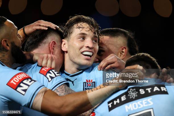 Bradman Best of the Blues celebrates scoring a try with Cameron Murray of the Blues during game three of the State of Origin series between New South...