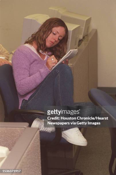 Jenna Barber takes notes in the cub reporter class during a talk by Claudia Feldman. The class was held at the Houston Chronicle at 801 Texas Ave....