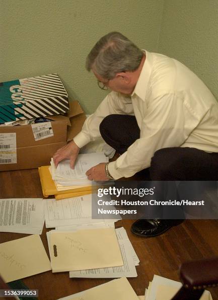 8/19/04Judge William H. Law looks through some legal paperwork in