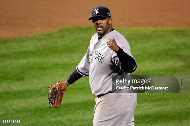 Sabathia of the New York Yankees reacts after Mark Reynolds of the Baltimore Orioles grounded out for the final out in the bottom of the eighth...