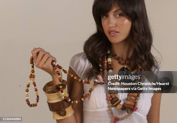 Model Amara DePaul wears a peasant blouse, $16.99 with wood accessories from Paula Fridkin. They include earrings, $48; bracelets, $5.90-$18; and...