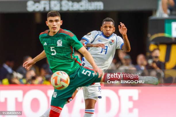 Mexico's defender Johan Vasquez and Panama's midfielder Alberto Quintero vie for the ball during the Concacaf 2023 Gold Cup final football match...
