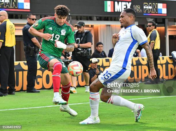 Mexico's defender Jorge Sanchez and Panama's defender Eric Davis vie for the ball during the Concacaf 2023 Gold Cup final football match between...