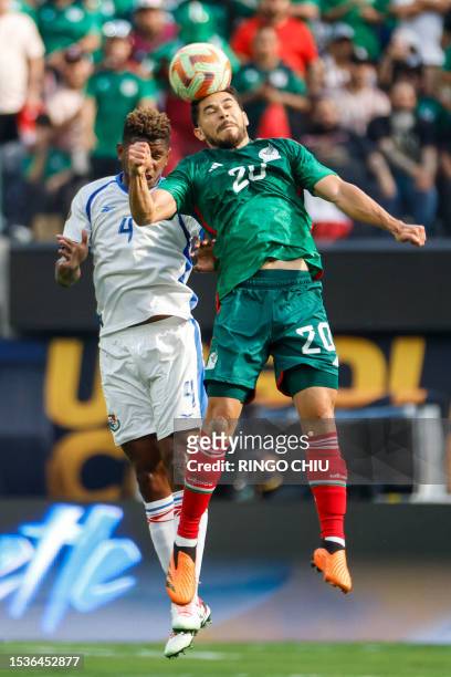 Panama's defender Fidel Escobar and Mexico's forward Henry Martin vie for the ball during the Concacaf 2023 Gold Cup final football match between...