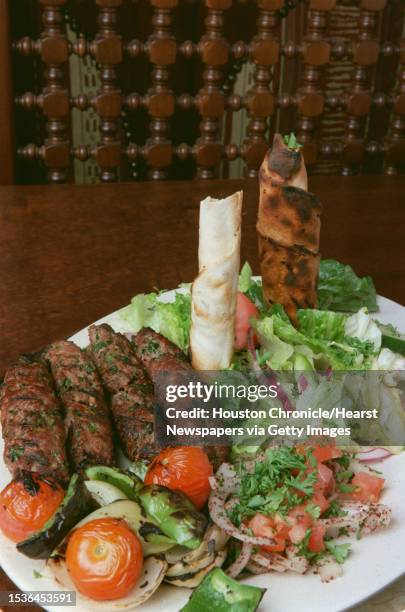 Kefta kebob is served with a salad at Petra Mediterranean Food at 10941 FM 1960.