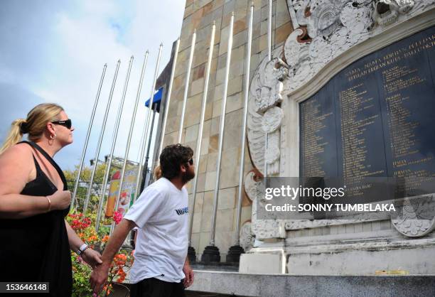 Australian Lee Harrison looks for the name of his sister, Nicole Harrison, on the wall of the monument for the 2002 Bali bombing victims four days...