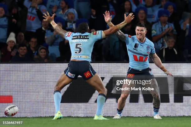 Bradman Best of the Blues celebrates with team mates after scoring a try during game three of the State of Origin series between New South Wales...