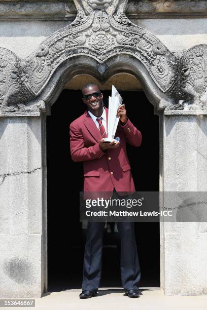 Darren Sammy, captain of the West Indies Cricket team poses for a photograph with the ICC World T20 Trophy at Independence Square on October 8, 2012...