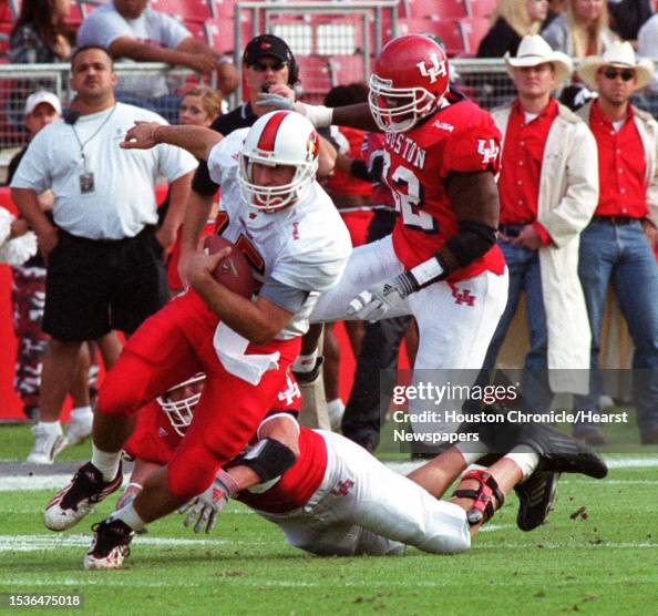 University of Louisville QB Dave Ragone scrambles for 8 yards in the ...