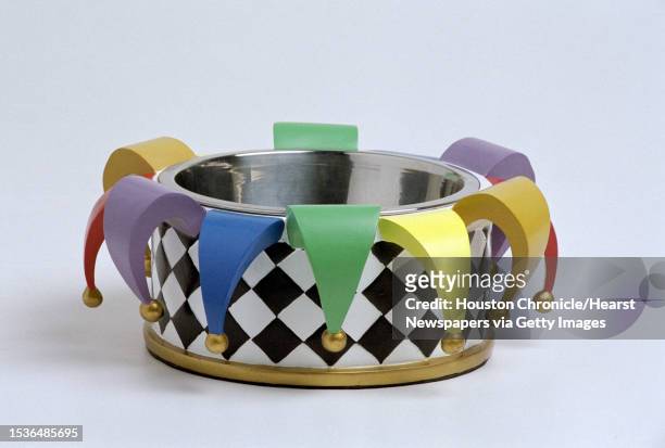 Multicolored dog dish in the shape of a jester's hat was shot in the Chronicle Studio for a story on pet products. HOUCHRON CAPTION : Pooches can eat...