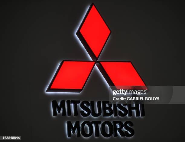The Mitsubishi logo is pictured during the press day of the LA Auto Show in Los Angeles, California on November 18, 2010. AFP PHOTO / GABRIEL BOUYS
