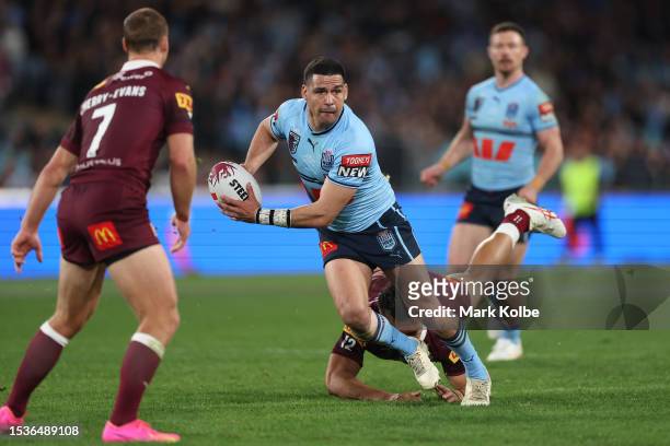 Cody Walker of the Blues is tackled during game three of the State of Origin series between New South Wales Blues and Queensland Maroons at Accor...