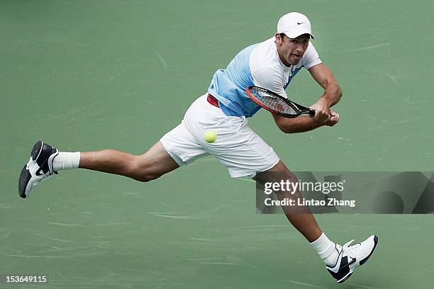 Lukasz Kubot of Poland returns a shot to Marin Cilic of Croatia during the day two of Shanghai Rolex Masters at the Qi Zhong Tennis Center on October...