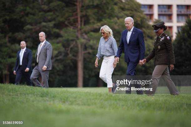 President Joe Biden, second right, and First Lady Jill Biden, center, arrive at Fort Lesley J. McNair in Washington, DC, US, on Sunday, July 16,...