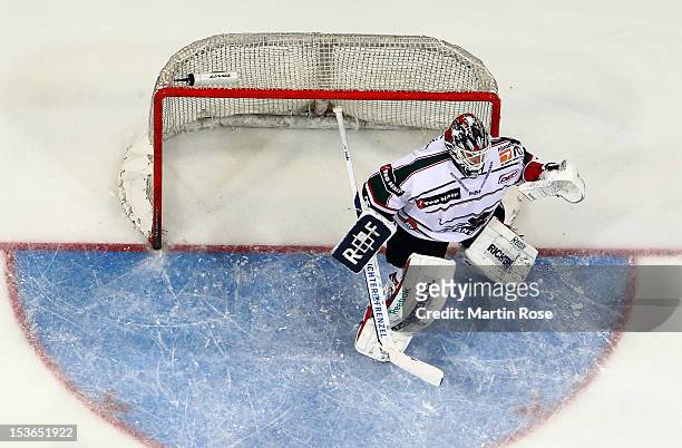 Patrick Ehelechner, goaltender of Augsburg makes a save during the DEL match between Hannover Scorpions and Augsburger Panther at TUI Arena on...
