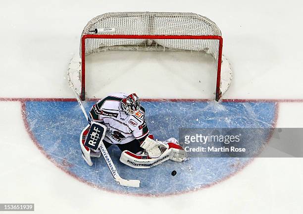 Patrick Ehelechner, goaltender of Augsburg makes a save during the DEL match between Hannover Scorpions and Augsburger Panther at TUI Arena on...