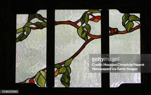 Stained glass window, made by Pamela Owens, is in the front door of her and her husband, Brien Owens, home. Several artists have moved into homes and...