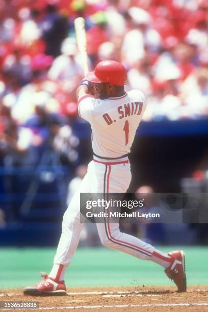 Ozzie Smith of the St. Louis Cardinals takes a swing during a baseball game against the New York Mets on June 29, 1991 at Busch Stadium in St. Louis,...