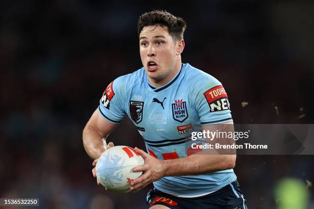 Mitchell Moses of the Blues runs the ball during game three of the State of Origin series between New South Wales Blues and Queensland Maroons at...